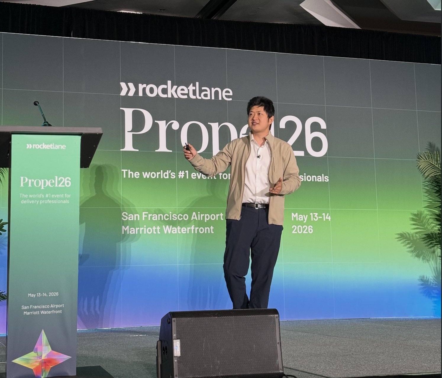 Kevin Bai delivering the Propel 2026 keynote at Rocketlane's conference