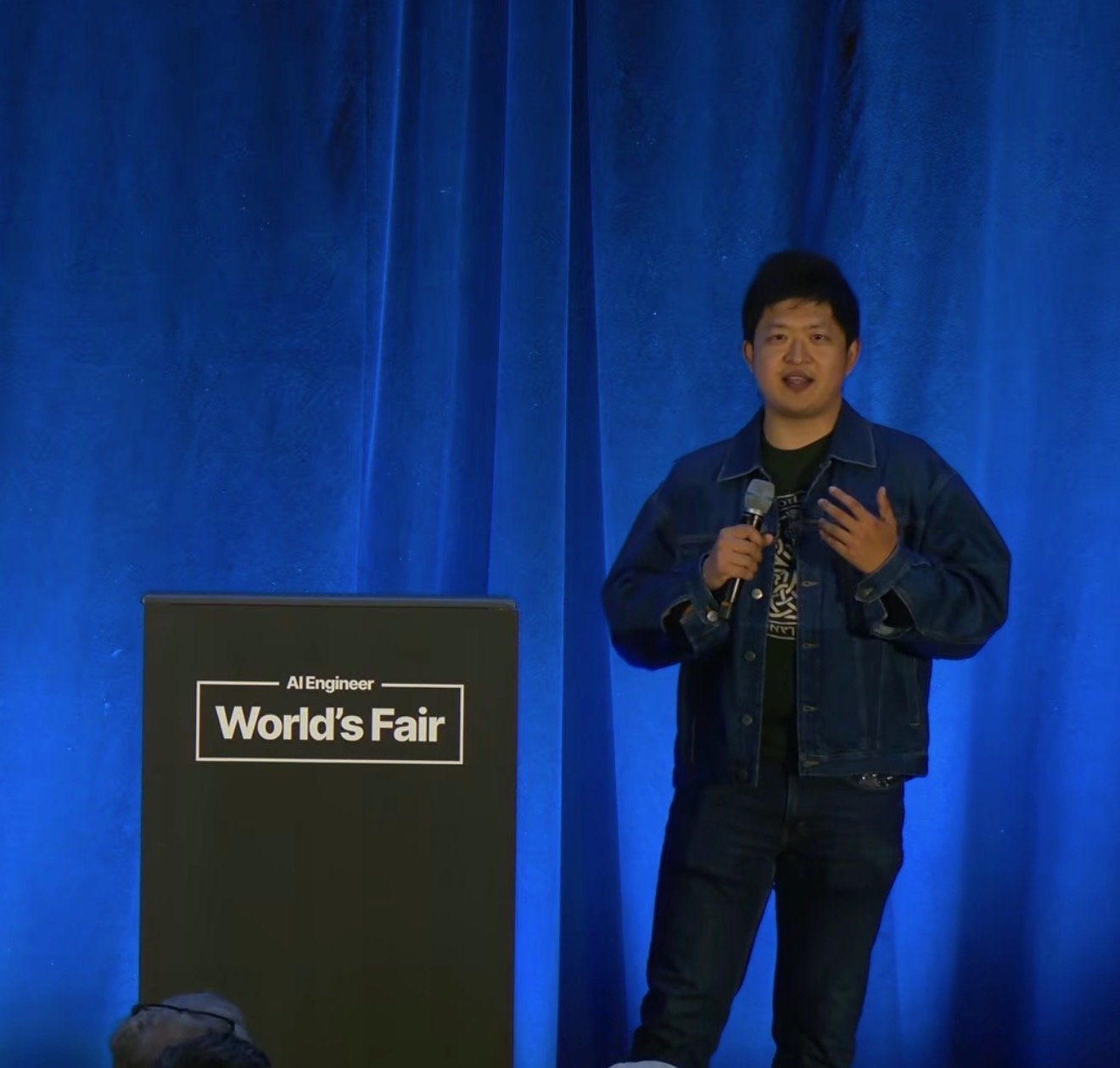 Kevin Bai speaking at the AI Engineer World's Fair