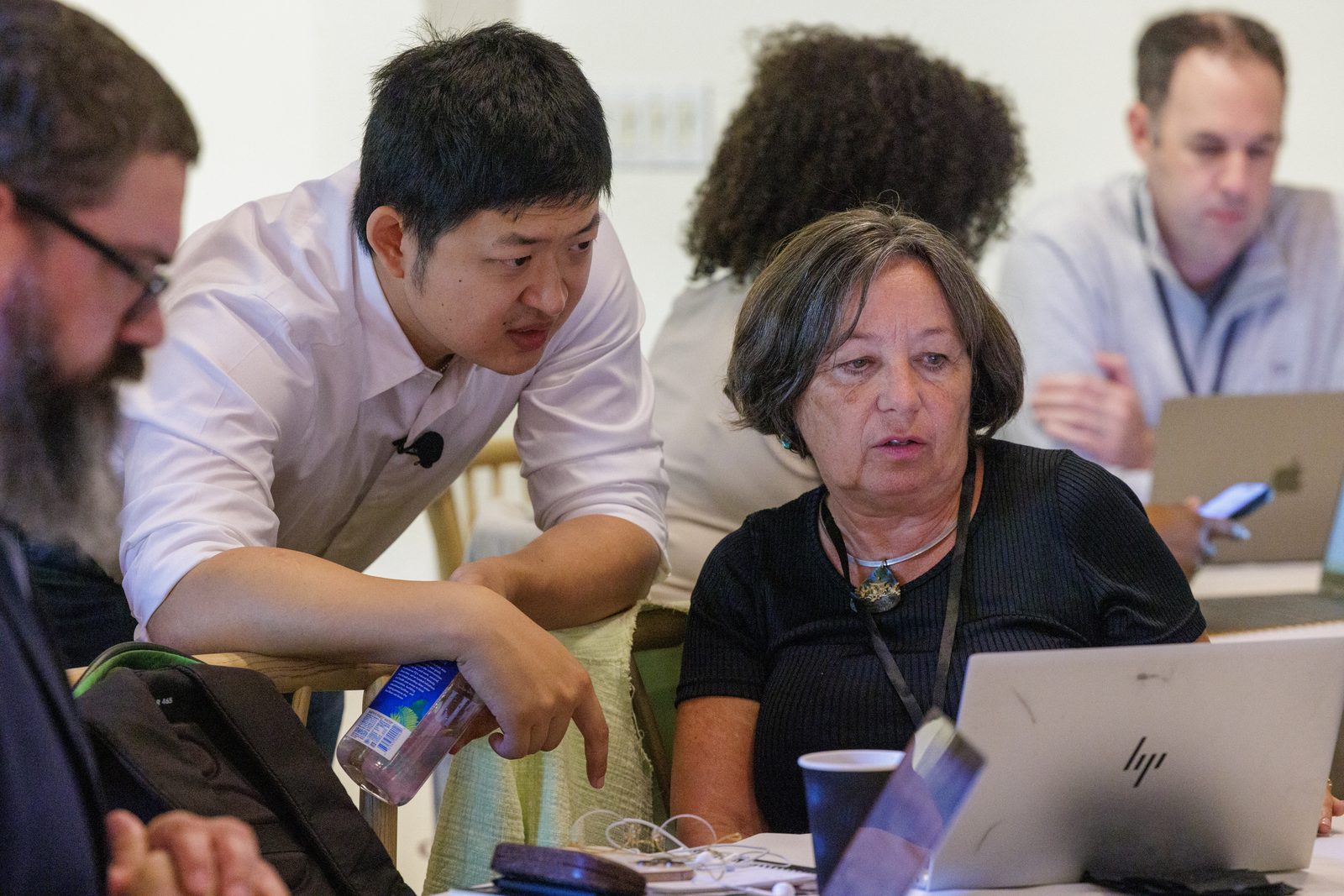 Kevin Bai working through a build with an attendee during the build hour