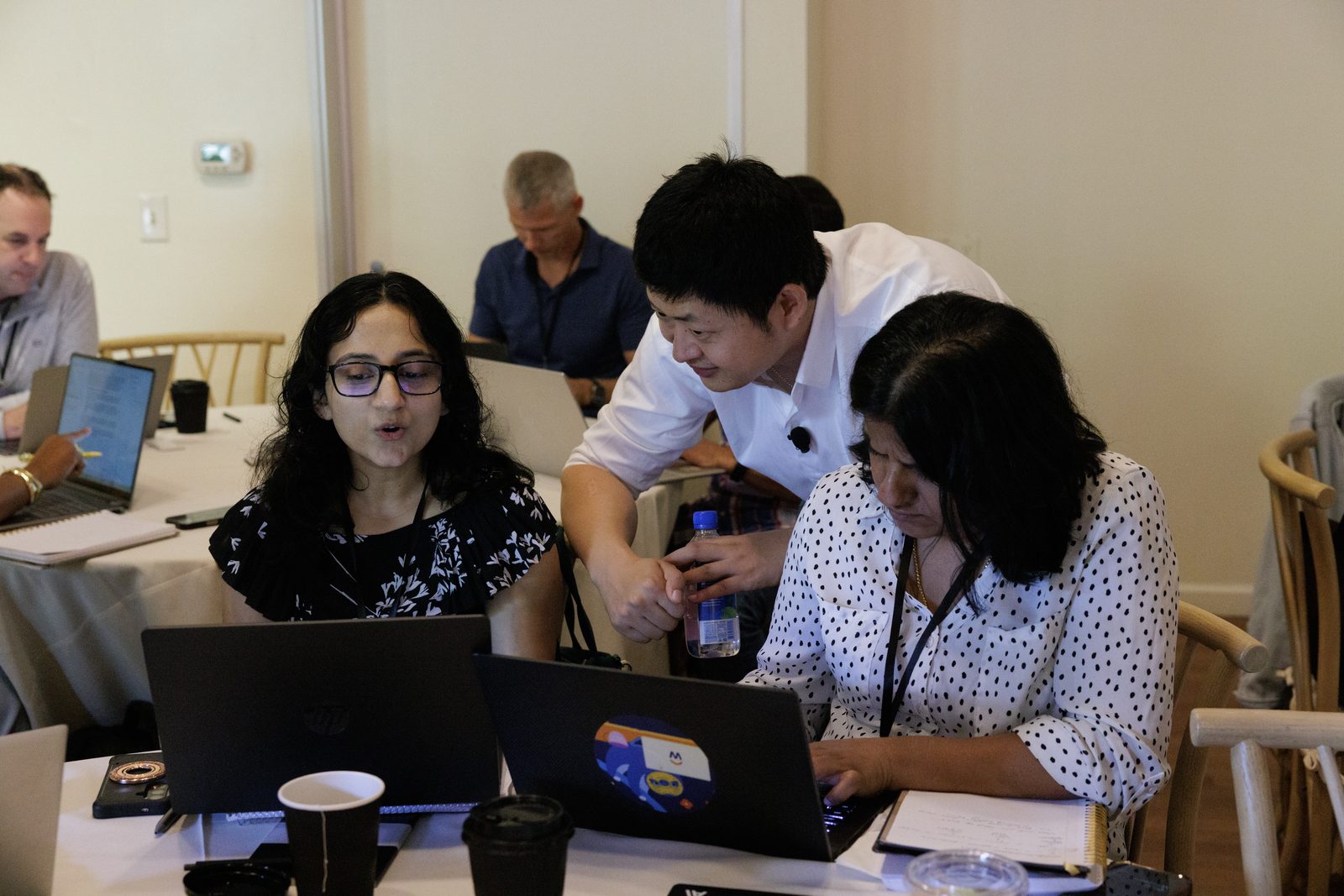 Attendees building agents at their laptops during the build hour