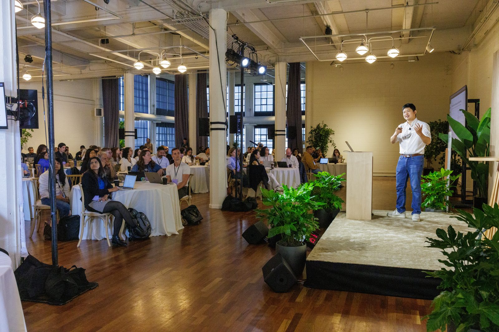 The Claude Coworkshop room in San Francisco, executives seated at tables
