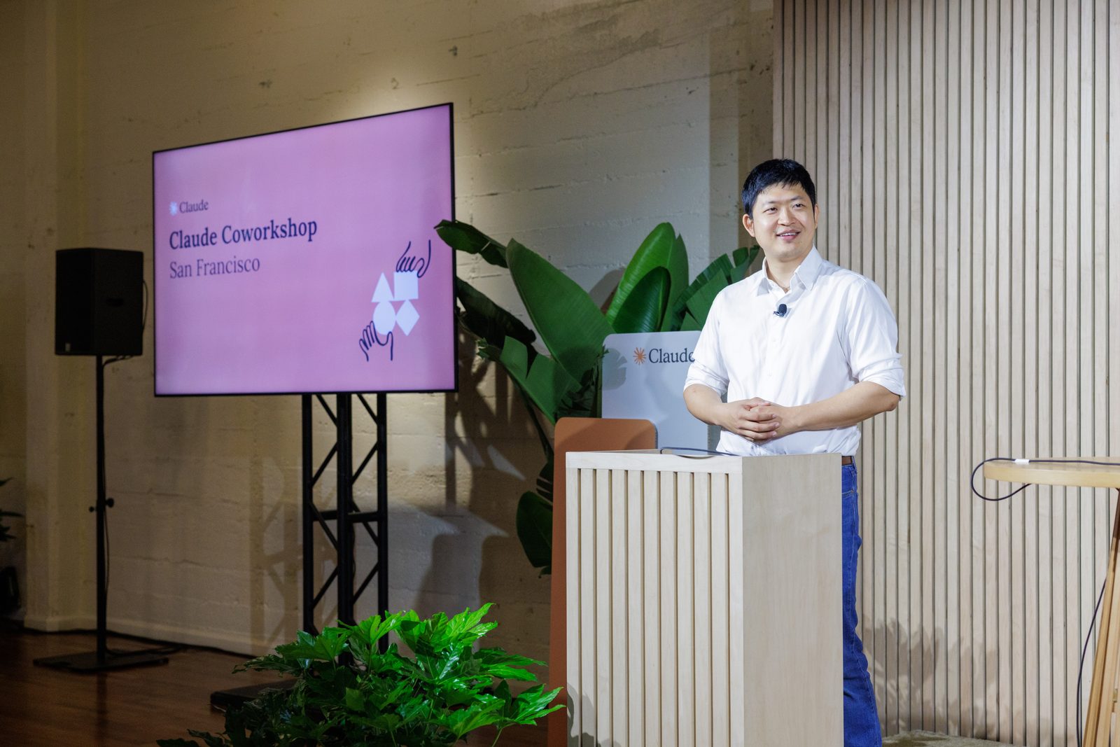 Kevin Bai on stage beside the Claude Coworkshop San Francisco title slide