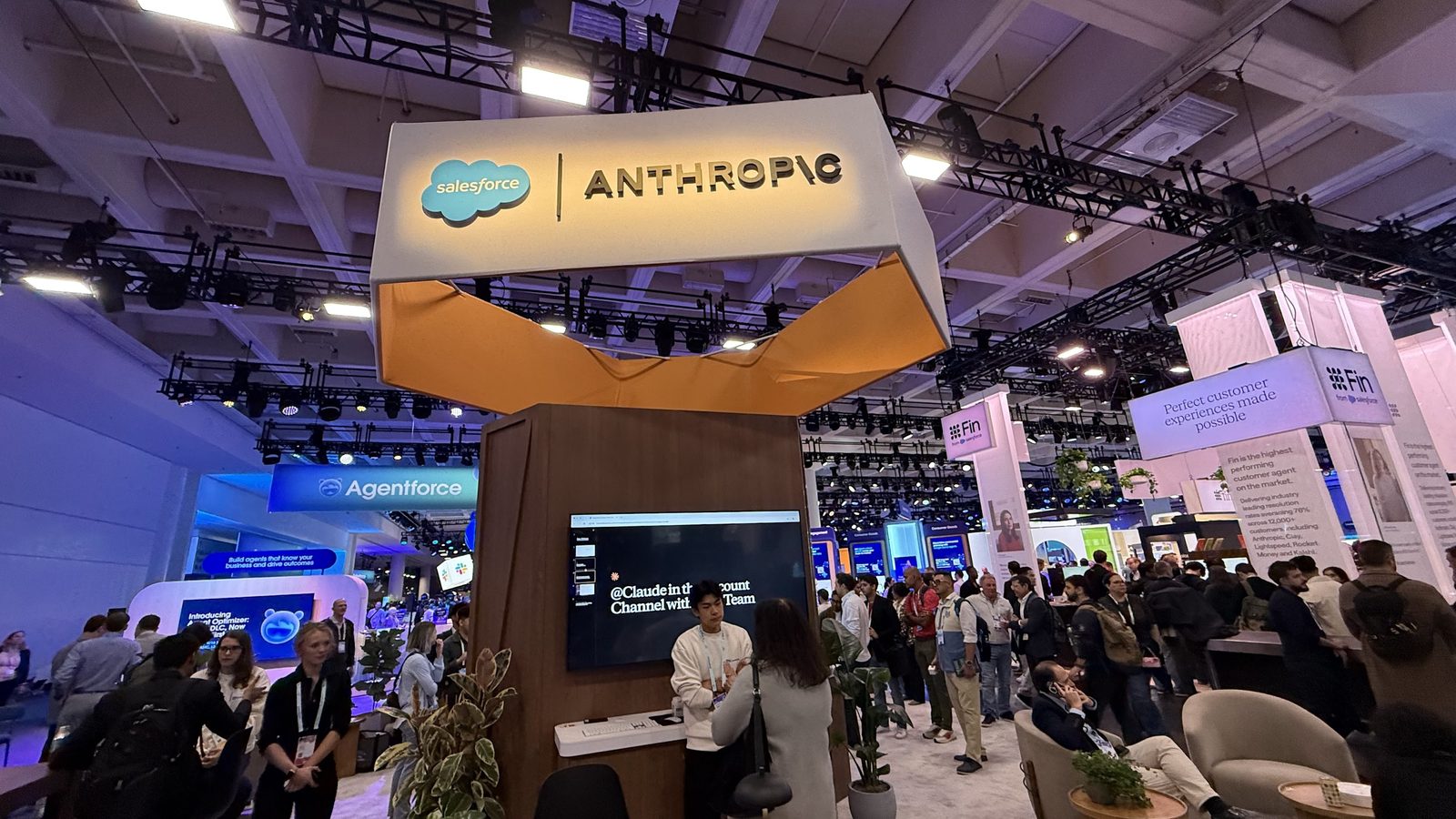 The Salesforce and Anthropic booth on the Dreamforce floor, crowd around the demo stations