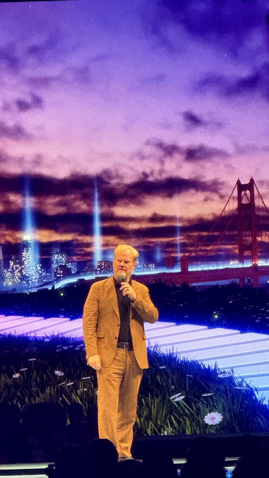 Jim Gaffigan closing out Dreamforce on stage in front of a Golden Gate Bridge backdrop